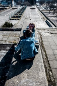 Sitting Man Wearing Blue Chambray Jacket