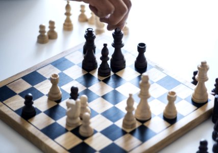 White And Black Chessboard With Pieces photo