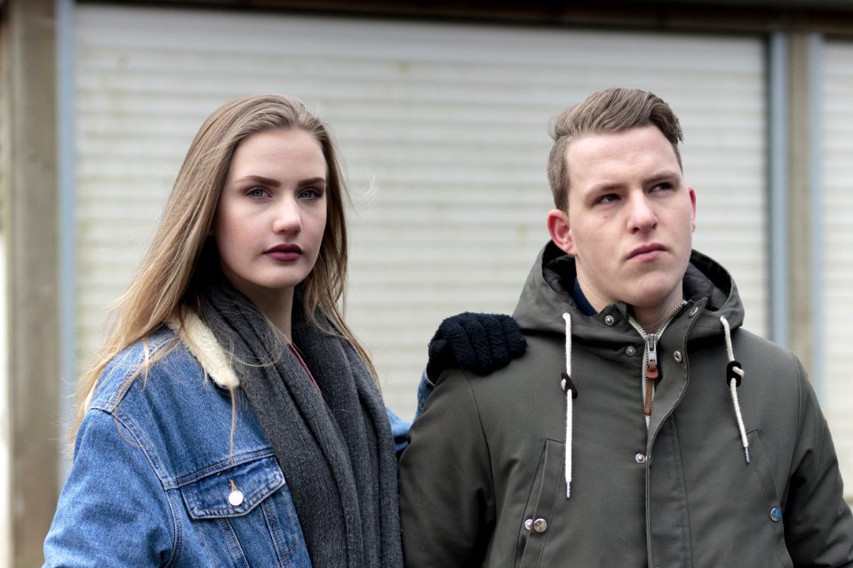 Man Wearing Gray Jacket Beside Woman Wearing Blue Denim Jacket