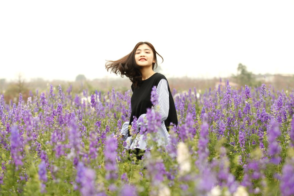 Woman With Black And White Long-sleeved Top On Garden