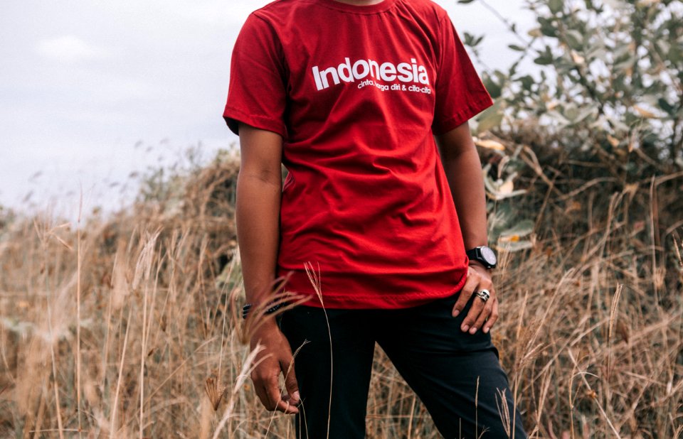 Man In Red Crew-neck T-shirt Beside Grasses