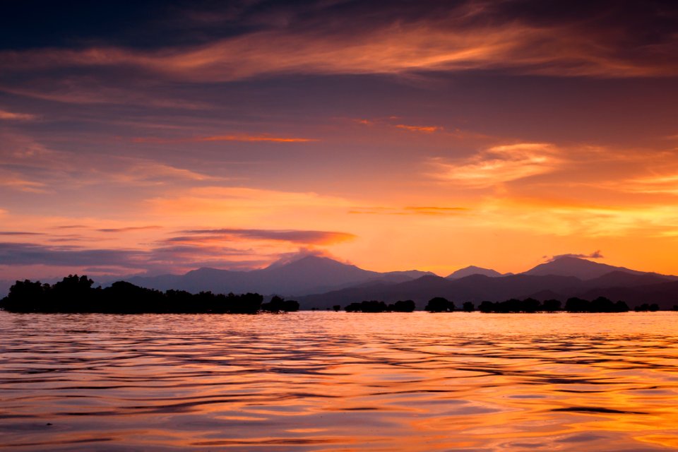 Photo Of Calm Sea During Golden Hour photo