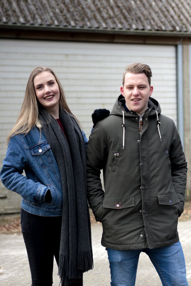 Man Wearing Black Coat And Woman Wearing Blue Denim Jacket photo