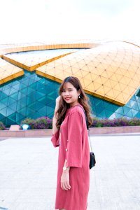 Woman In Pink Long-sleeved Dress photo