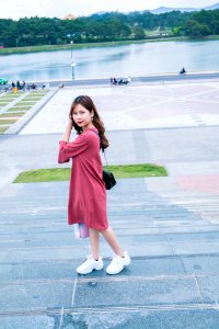 Woman Wearing Pink 34-sleeved Midi Dress