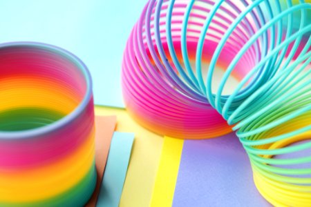 Two Multicolored Slinky Toys photo