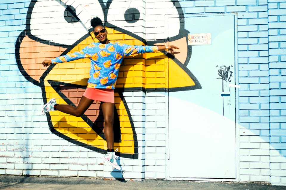Girl In Blue Sweatshirt And Pink Skit In Jumpshot Photo