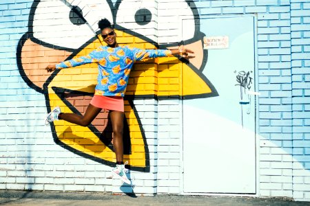 Girl In Blue Sweatshirt And Pink Skit In Jumpshot Photo