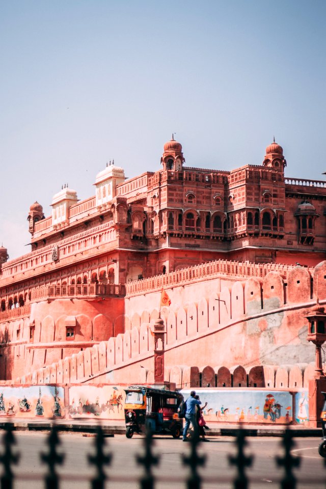 Auto Rickshaw Parked Beside Brown Structure