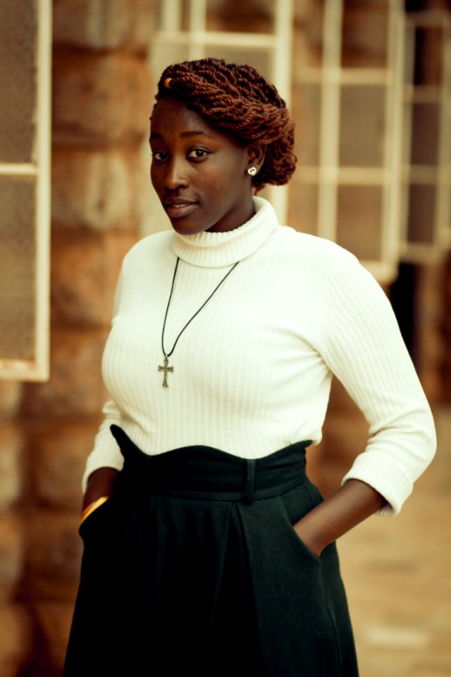 Woman Wearing White Knit Sweater And Black Skirt photo