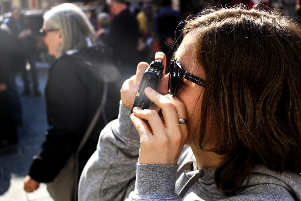 Woman Holding Point-and-shoot Camera With Gray Jacket