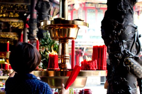 Woman Holding Incense Sticks