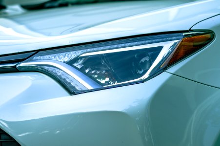 Close-Up Photography Of Car Headlight photo