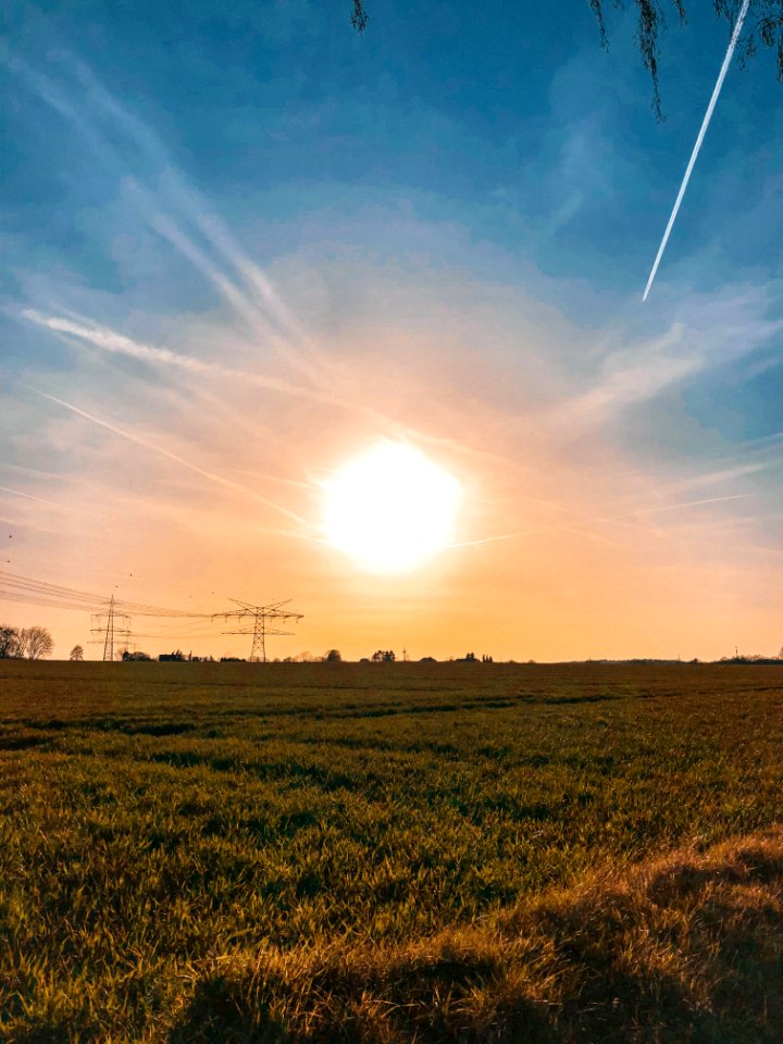 Green Grass Field During Sunset