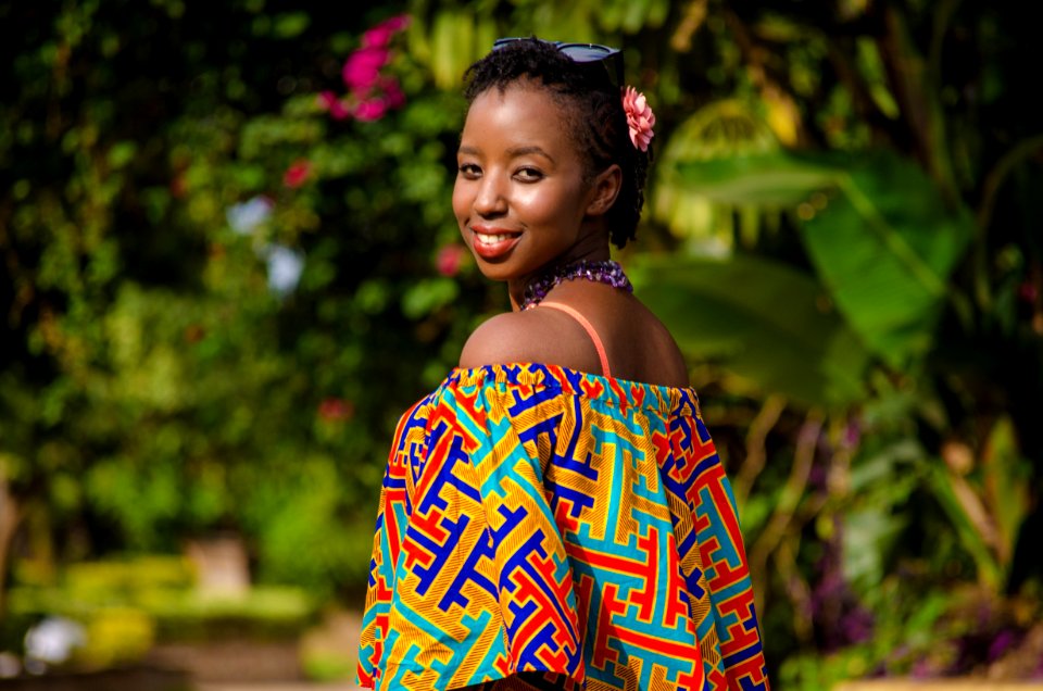 Shallow Focus Photography Of Woman Wearing Multicolored Off-shoulder Top