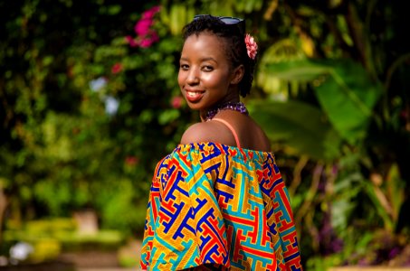 Shallow Focus Photography Of Woman Wearing Multicolored Off-shoulder Top photo