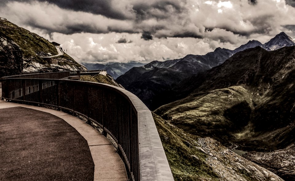 Gray Metal Railings On Top Of Hill Under Gray Cloudy Sky At Daytime