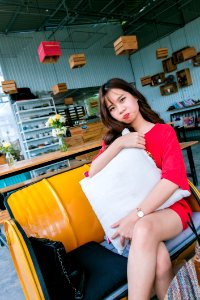 Woman Sitting On Yellow Couch photo