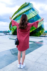 Woman Standing In-front Of Glass Building