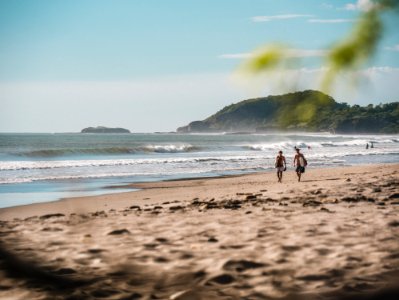 Two Person Walking On Beachside photo