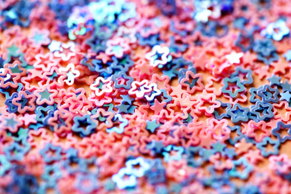 Shallow Focus Photography Of Pink And Blue Star Figures