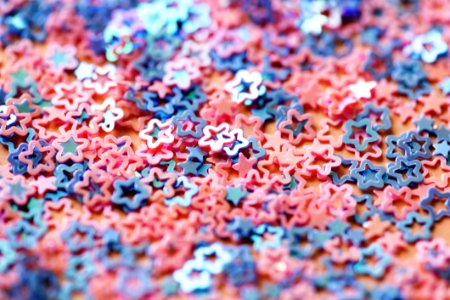 Shallow Focus Photography Of Pink And Blue Star Figures photo