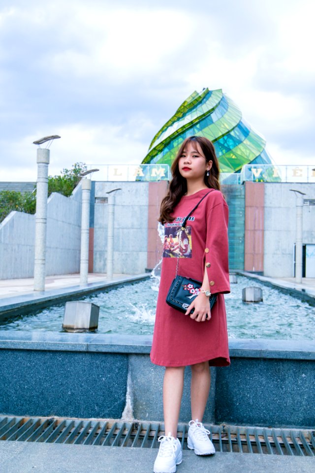 Woman In Front Of Body Of Water