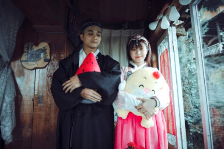 Man And Woman Wearing Traditional Dresses photo