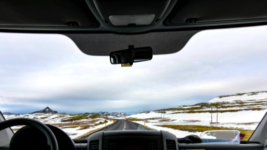 Vehicle In Between Snow Covered Field