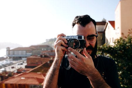 Man Holding Gray Point-and-shoot Camera photo