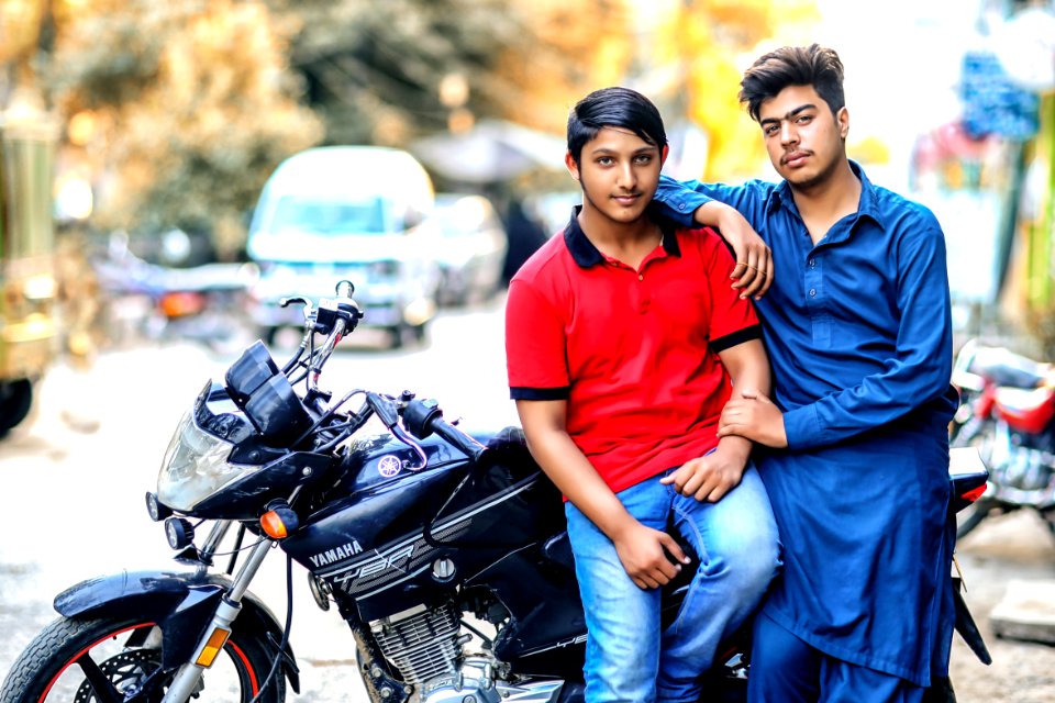 Two Men And Red And Blue Shirts