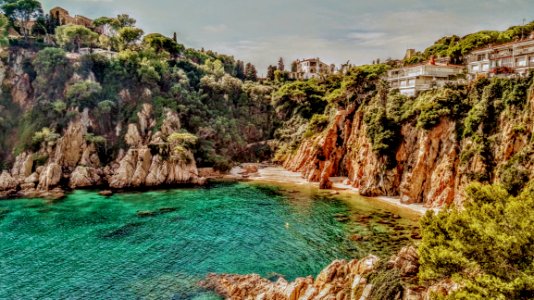 Photo Of Body Of Water Surrounded By Cliff photo