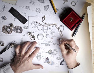 Jewelry Designer Designs Jewelries On Paper photo