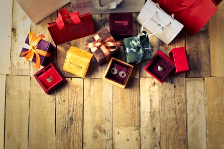 Assorted Gift Boxes On Brown Wooden Floor Surface photo