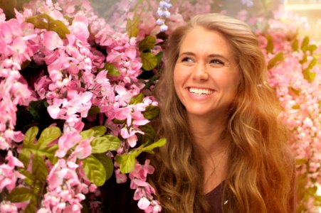 Photo Of Woman Standing Beside Pink Flowers photo