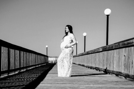Grayscale Photo Of Pregnant Woman Wearing Maxi Dress photo