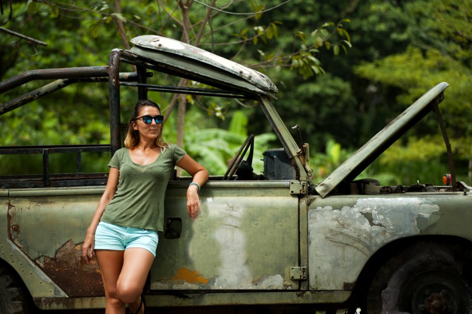 Woman Leaning On Wrangler With Hood Open