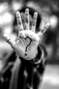 Person With Question Mark On His Palm photo