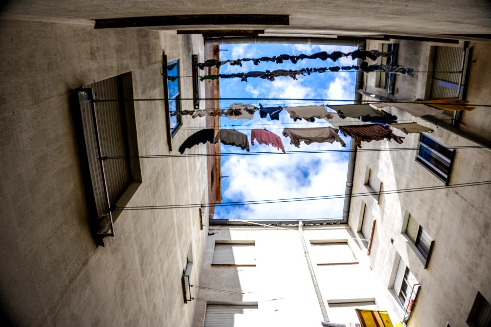 Assorted Clothes Hanging On Wire