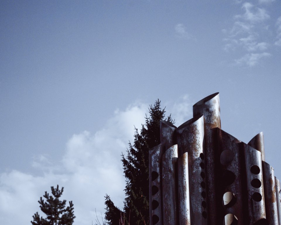 Grey Tower Near Green Leaf Tree