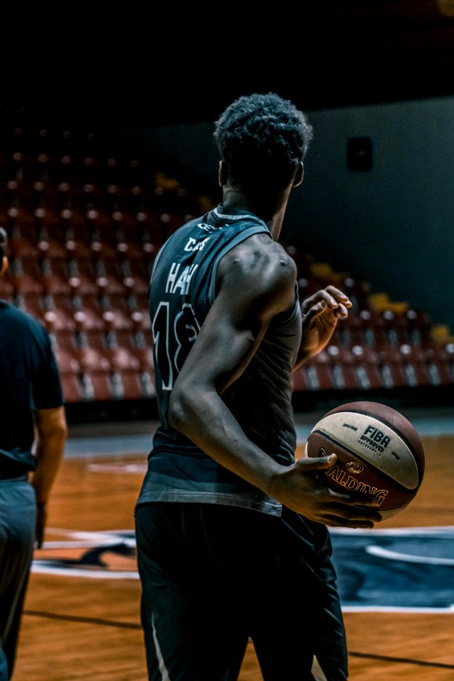 Man Holding Fiba Basketball