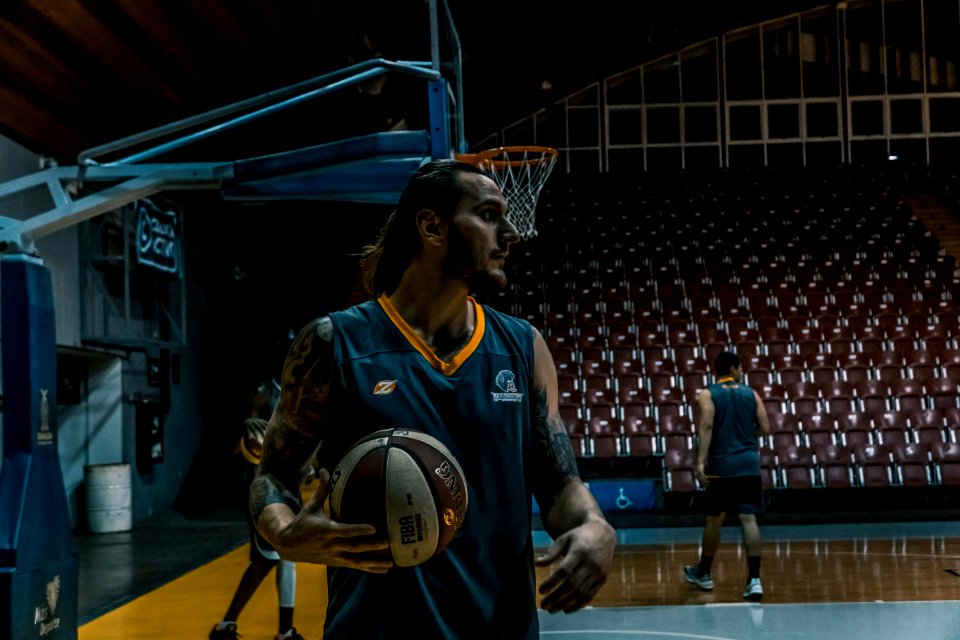 Man In Blue And Yellow Basketball Jersey Top