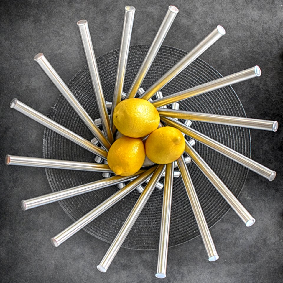 Three Lemon Fruits On Steel Bowl