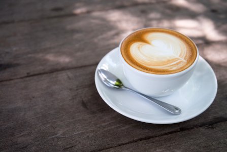 White Ceramic Coffee Cup With White Ceramic Saucer photo