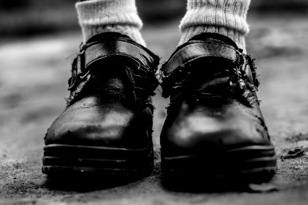Grayscale Photo Of Black Leather Hoop-and-look Shoies