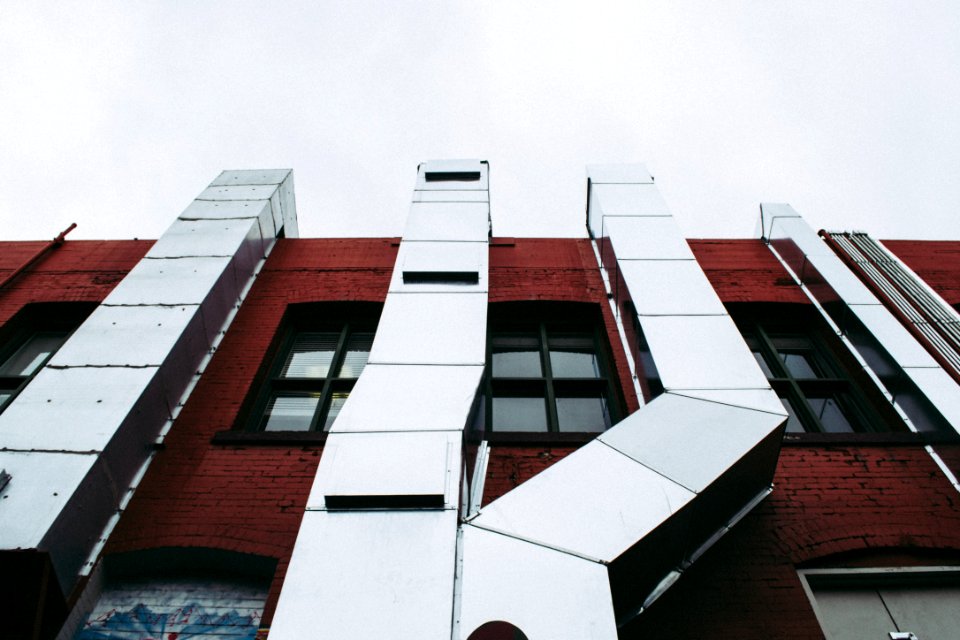 Brown Concrete Building With Grey Air Ventilatios