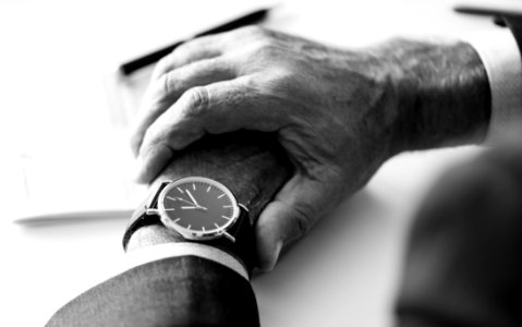 Person Wearing Round Silver-colored Analog Watch photo