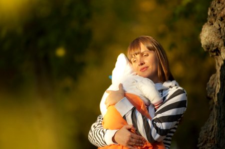 Selective Focus Photo Of Woman Carrying Baby photo