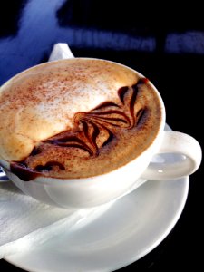 Cappuccino On White Ceramic Cup With Saucer photo