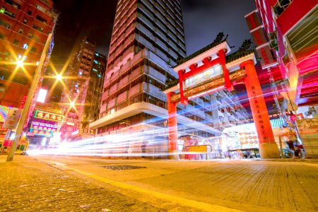 Time Lapse Photography Of Vehicles Passing Through China Town photo